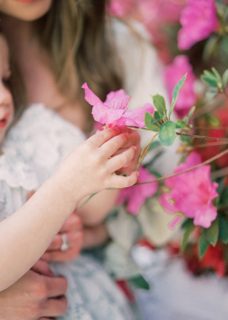 little girl picking flower