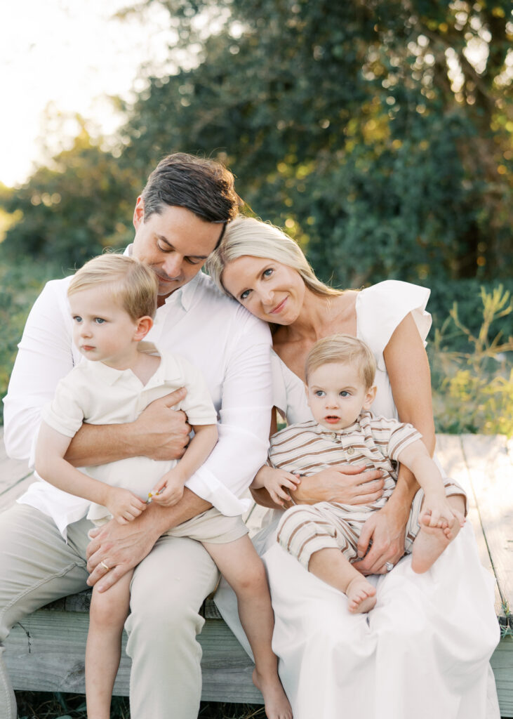 family in white for beach session on sullivans island